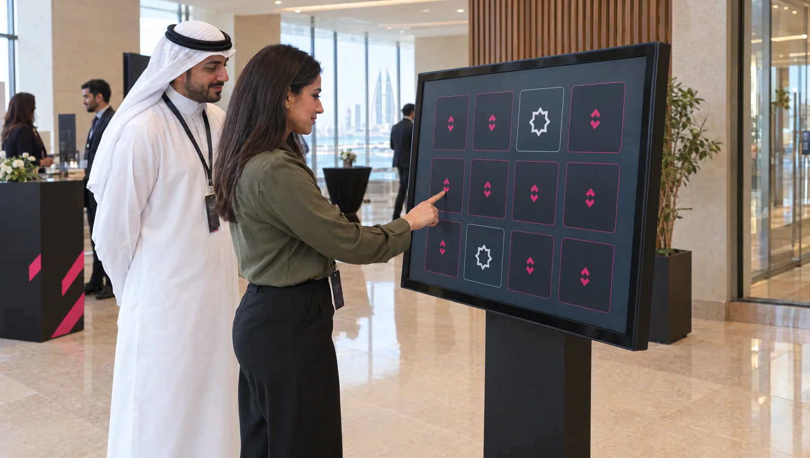Concept of a visitor playing a memory game on a branded touchscreen at a Bahrain event